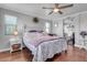 Main bedroom with king bed, hardwood floors and ensuite bath at 19646 E Reins Rd, Queen Creek, AZ 85142