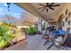 Outdoor patio furniture under covered patio with a view of the backyard at 19646 E Reins Rd, Queen Creek, AZ 85142