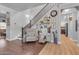 Elegant staircase with dark wood railings and gallery wall at 19646 E Reins Rd, Queen Creek, AZ 85142