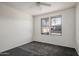 Bright bedroom with grey carpet and large windows at 19777 N 76Th St # 2292, Scottsdale, AZ 85255