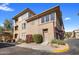 Tan building exterior with multiple entrances and landscaping at 19777 N 76Th St # 2292, Scottsdale, AZ 85255