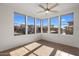 Sun-drenched common area with tile floors and ceiling fan at 19777 N 76Th St # 2292, Scottsdale, AZ 85255