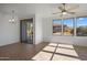 Common area with sliding door to balcony and tile floors at 19777 N 76Th St # 2292, Scottsdale, AZ 85255