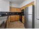 Bright kitchen with stainless steel appliances and wood cabinets at 19777 N 76Th St # 2292, Scottsdale, AZ 85255