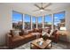 Comfortable living area flooded with natural light and furnished with a large sectional sofa and stylish accents at 19777 N 76Th St # 2292, Scottsdale, AZ 85255