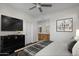 Stylish main bedroom featuring a ceiling fan, TV, and ensuite bath access at 19777 N 76Th St # 2292, Scottsdale, AZ 85255