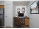Home office nook with built-in desk and stylish decor, creating a functional workspace at 19777 N 76Th St # 2292, Scottsdale, AZ 85255