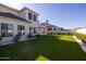 Artificial turf backyard with home view at 20684 E Natalie Way, Queen Creek, AZ 85142