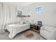 Well-lit bedroom with a record player and stylish decor at 20684 E Natalie Way, Queen Creek, AZ 85142