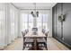 Elegant dining room with a large wooden table and black accent wall at 20684 E Natalie Way, Queen Creek, AZ 85142