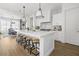 Modern kitchen with a large island, white cabinets, and stainless steel appliances at 20684 E Natalie Way, Queen Creek, AZ 85142