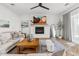 Bright and airy living room featuring a fireplace and comfortable seating at 20684 E Natalie Way, Queen Creek, AZ 85142