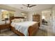 Main bedroom with wooden sleigh bed, dresser, and ensuite bathroom at 2235 E Vista Ave, Phoenix, AZ 85020