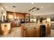 Modern kitchen with light wood cabinets, granite island, and stainless steel appliances at 2235 E Vista Ave, Phoenix, AZ 85020