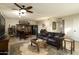 Living room with fireplace, leather sofa, and game table at 2235 E Vista Ave, Phoenix, AZ 85020