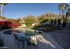 Inviting kidney-shaped pool with mountain views and comfortable seating at 2235 E Vista Ave, Phoenix, AZ 85020