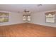 Bright bedroom featuring wood flooring, ceiling fan and window coverings at 22830 N 32Nd Ln, Phoenix, AZ 85027