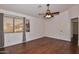 Bright bedroom with wood floors and large window at 22830 N 32Nd Ln, Phoenix, AZ 85027