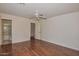 Bright bedroom featuring wood floors and a private bathroom at 22830 N 32Nd Ln, Phoenix, AZ 85027