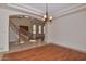 Bright dining room with hardwood floors and access to the entryway at 22830 N 32Nd Ln, Phoenix, AZ 85027