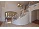 Elegant entryway with a curved staircase and chandelier at 22830 N 32Nd Ln, Phoenix, AZ 85027