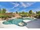 Relaxing pool area with unique shape and shaded seating at 22830 N 32Nd Ln, Phoenix, AZ 85027