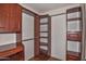 Large walk-in closet with ample shelving and hanging space at 22830 N 32Nd Ln, Phoenix, AZ 85027