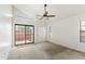 Bright bedroom with sliding doors to patio and ceiling fan at 23570 N 75Th N St, Scottsdale, AZ 85255