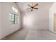 Well-lit bedroom with ceiling fan and carpet at 23570 N 75Th N St, Scottsdale, AZ 85255