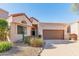 Single story home with a two car garage and desert landscaping at 23570 N 75Th N St, Scottsdale, AZ 85255