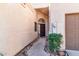 Inviting front entrance with wrought iron door and landscaping at 23570 N 75Th N St, Scottsdale, AZ 85255