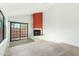 Living room with fireplace and sliding glass doors to patio at 23570 N 75Th N St, Scottsdale, AZ 85255