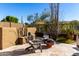 Landscaped backyard with fire pit and seating area at 24029 N 76Th Pl, Scottsdale, AZ 85255