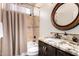 Bathroom with granite vanity and decorative mirror at 24029 N 76Th Pl, Scottsdale, AZ 85255