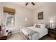 Cozy bedroom with white metal bed frame and window at 24029 N 76Th Pl, Scottsdale, AZ 85255