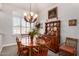 Elegant dining room with a round table and charming hutch at 24029 N 76Th Pl, Scottsdale, AZ 85255