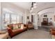 Spacious living room featuring a fireplace and ample natural light at 24029 N 76Th Pl, Scottsdale, AZ 85255