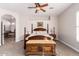 Large main bedroom with a wooden bed frame and an ensuite bathroom at 24029 N 76Th Pl, Scottsdale, AZ 85255