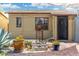 Landscaped backyard with brick patio, shade sail, and mature tree at 2434 E Pinchot Ave, Phoenix, AZ 85016