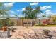 Backyard with brick patio, wooden compost bin, and raised garden beds at 2434 E Pinchot Ave, Phoenix, AZ 85016