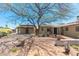 Backyard with brick patio, mature tree, and detached structure at 2434 E Pinchot Ave, Phoenix, AZ 85016