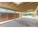 Covered carport with a wooden fence and backyard view at 2434 E Pinchot Ave, Phoenix, AZ 85016