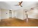 Open living area with concrete floors and a stylish chandelier at 2434 E Pinchot Ave, Phoenix, AZ 85016