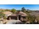 Single-story home with a brown roof and two-car garage at 27121 N 84Th Dr, Peoria, AZ 85383