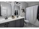 Modern bathroom with double vanity and walk-in shower at 27121 N 84Th Dr, Peoria, AZ 85383