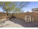 Small patio with modern metal table and chairs at 27121 N 84Th Dr, Peoria, AZ 85383