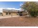 Backyard view of house with pergola and landscaping at 313 W Saddle Mountain Rd, Phoenix, AZ 85086