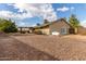 House exterior and backyard with gravel and landscaping at 313 W Saddle Mountain Rd, Phoenix, AZ 85086