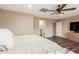 Bright bedroom with a ceiling fan and en-suite bathroom at 313 W Saddle Mountain Rd, Phoenix, AZ 85086