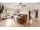 Spacious living room with leather furniture and tile floors at 313 W Saddle Mountain Rd, Phoenix, AZ 85086